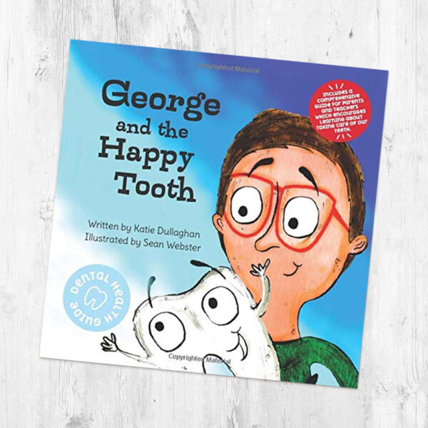 george and the happy tooth book on a table